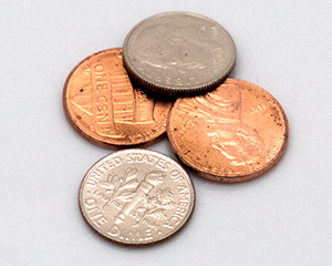 image of two dimes and two pennies